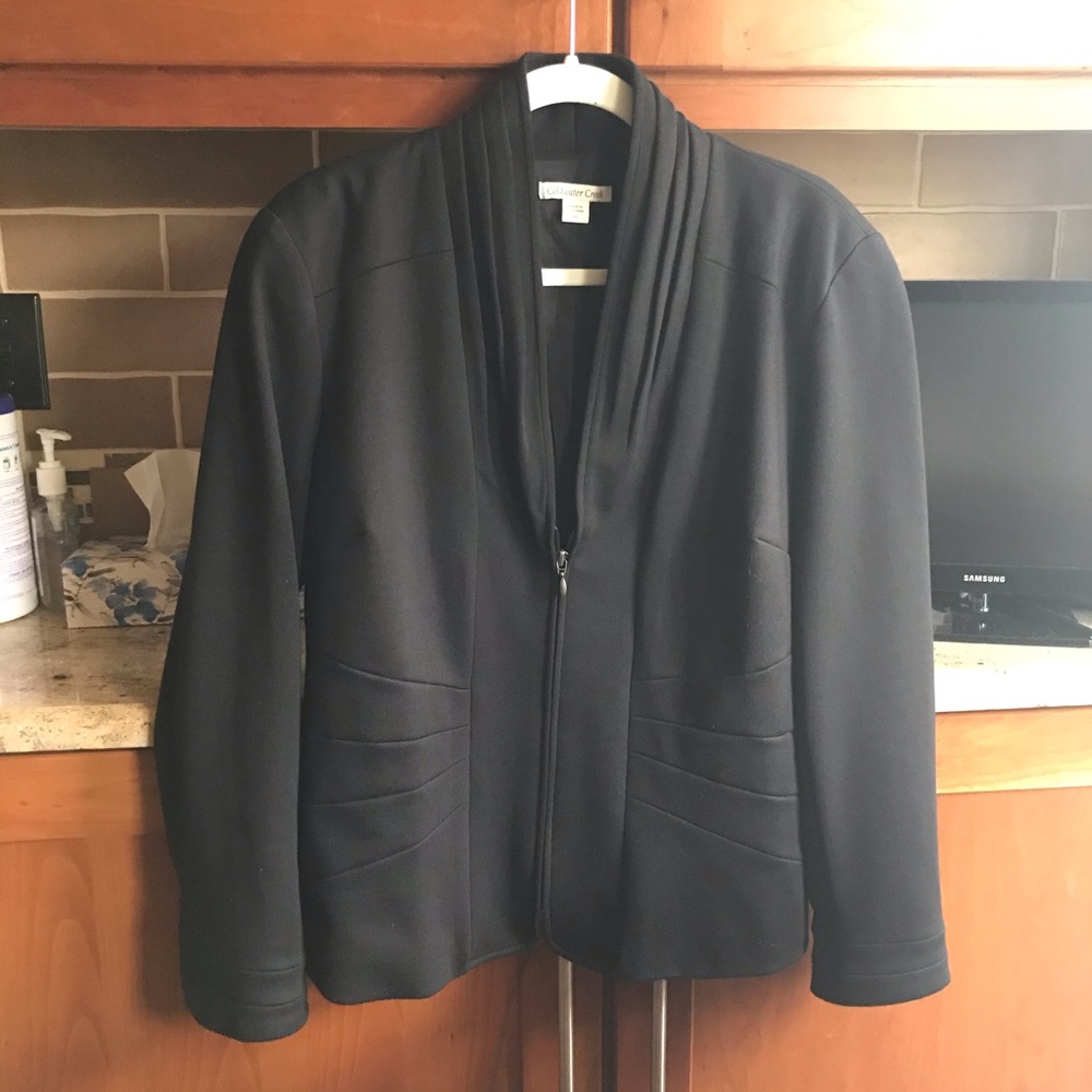 Black zip up blazer.